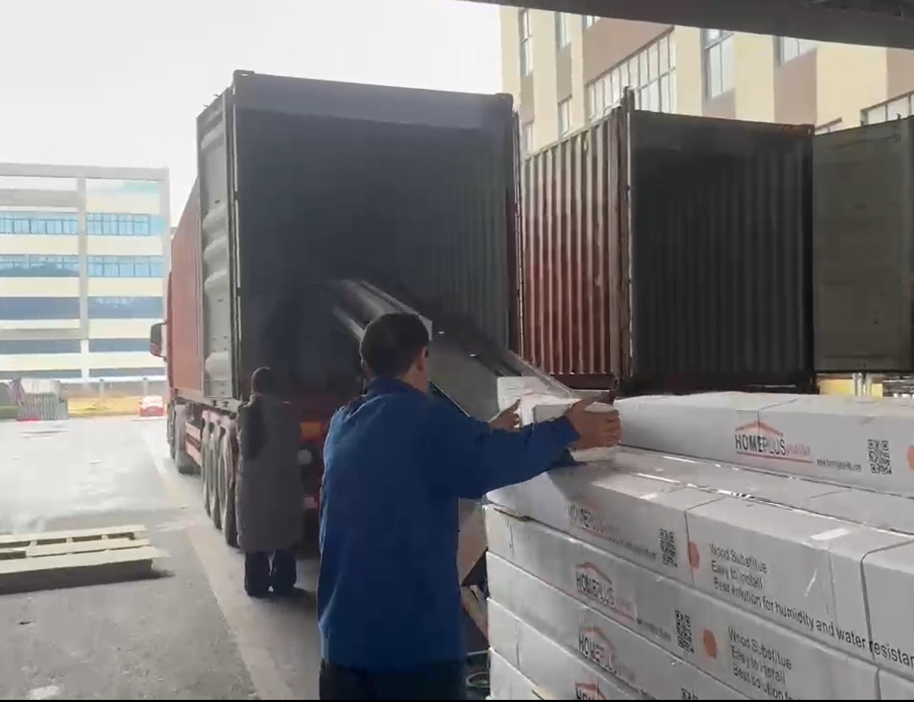 Home Plus products being loaded into an export container