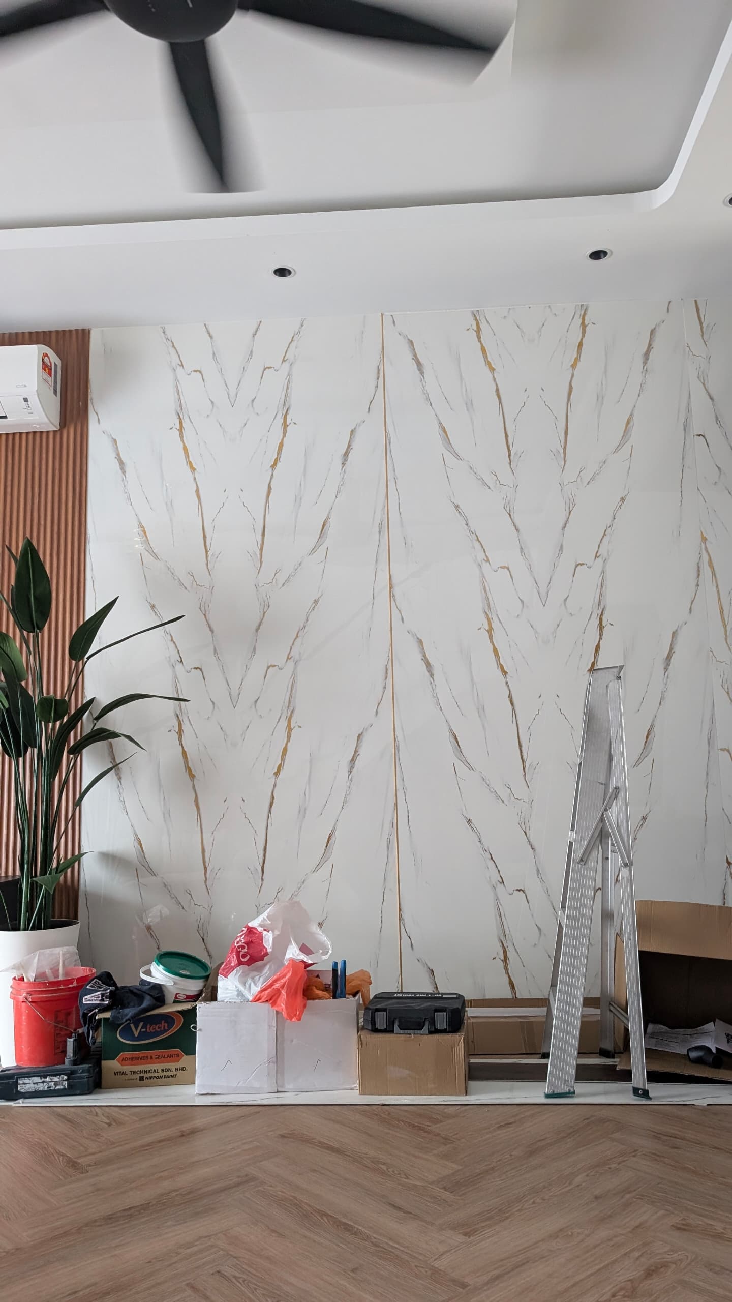 Wall Installation Site White marble-pattern UV sheets installed as a full-height feature wall by Home Plus Materials